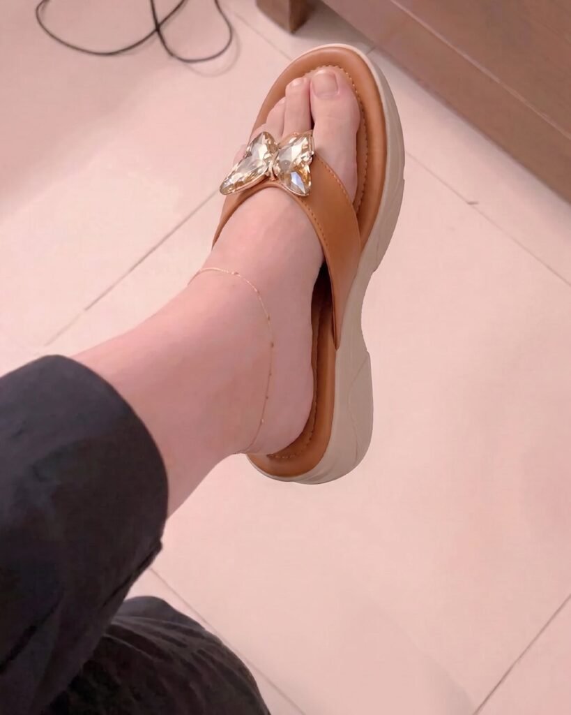 Aura Shoes customer photo — butterfly flip-flop